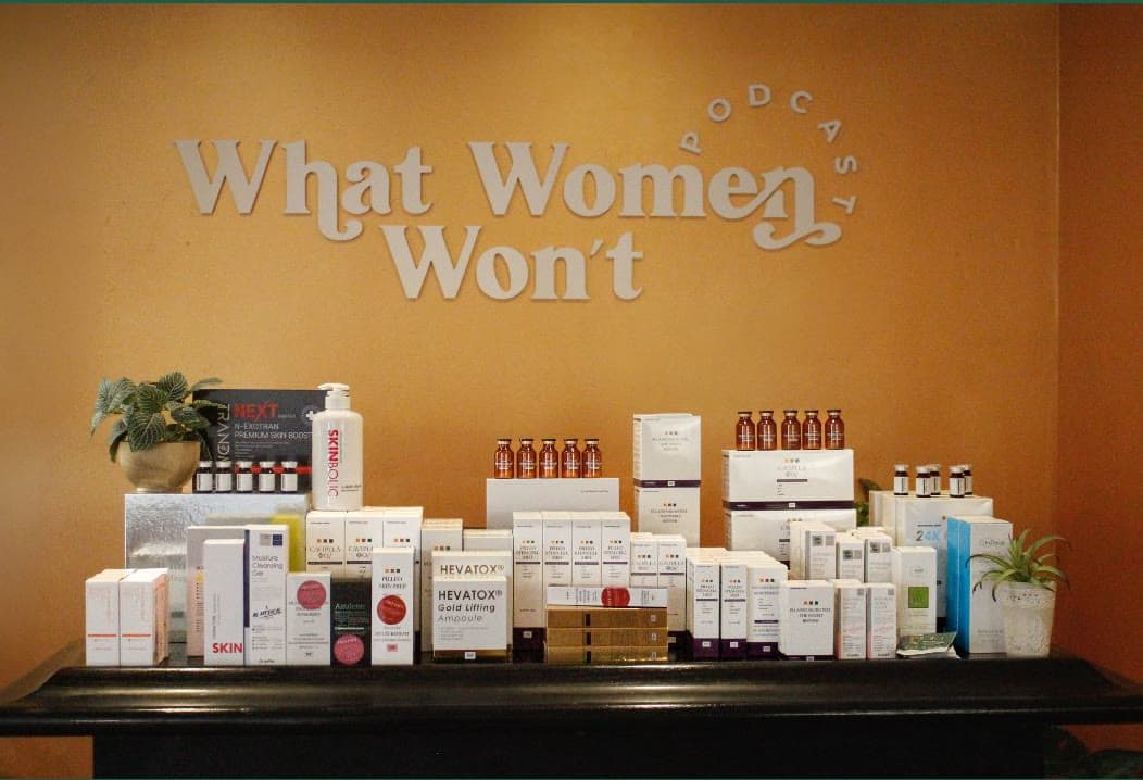 The What Women Won't podcast set with skincare on display